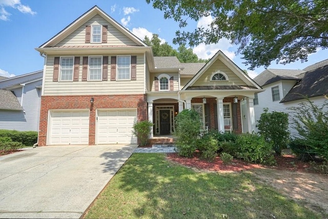 view of front facade featuring a garage, a front yard, concrete driveway, and brick siding