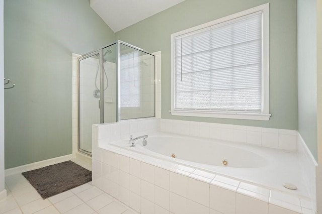 full bath with a stall shower, tile patterned flooring, a jetted tub, and baseboards