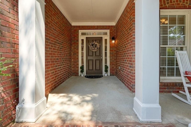 property entrance with brick siding