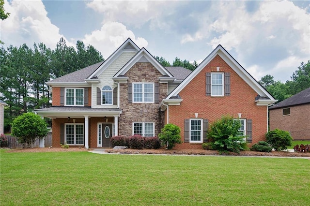 5635 Upper Creek Ct, Suwanee, GA 30024 - view of front of home with a front lawn, stone siding, and brick siding
