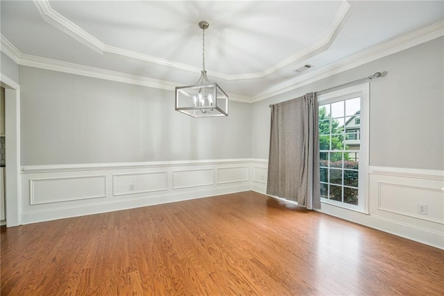 5635 Upper Creek Ct, Suwanee, GA 30024 - spare room with a chandelier, wood finished floors, ornamental molding, wainscoting, and a tray ceiling