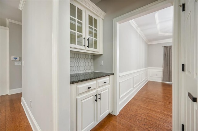 5635 Upper Creek Ct, Suwanee, GA 30024 - hall with wood finished floors, crown molding, and wainscoting