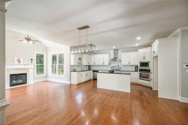 5635 Upper Creek Ct, Suwanee, GA 30024 - kitchen with wall chimney exhaust hood, stainless steel appliances, dark countertops, a sink, and tasteful backsplash