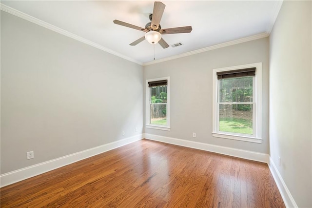 5635 Upper Creek Ct, Suwanee, GA 30024 - empty room featuring healthy amount of natural light, wood finished floors, baseboards, ceiling fan, and ornamental molding