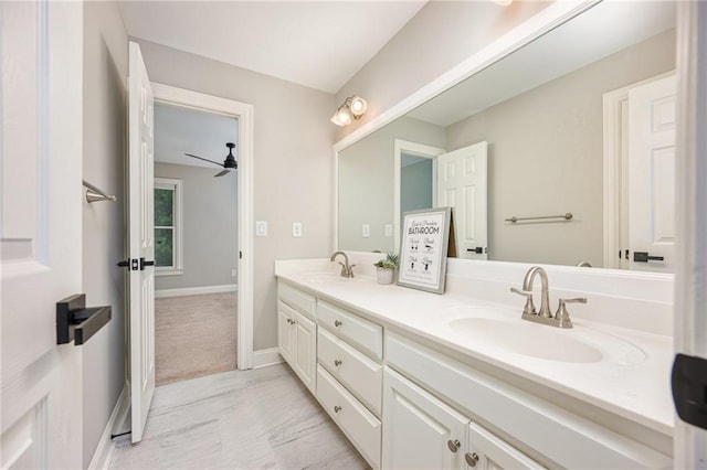 5635 Upper Creek Ct, Suwanee, GA 30024 - full bathroom with double vanity, baseboards, and a ceiling fan