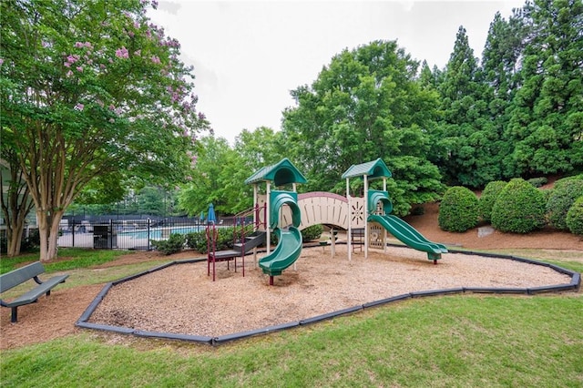 5635 Upper Creek Ct, Suwanee, GA 30024 - community jungle gym featuring view of wooded area