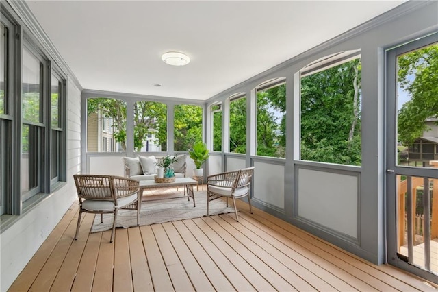 sunroom / solarium featuring an outdoor hangout area