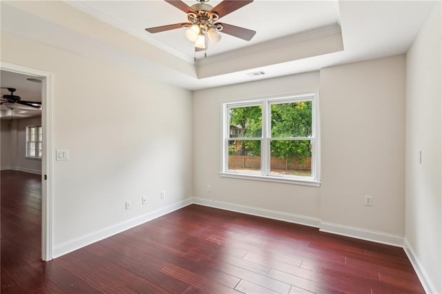 unfurnished room featuring ornamental molding, baseboards, ceiling fan, and hardwood / wood-style flooring