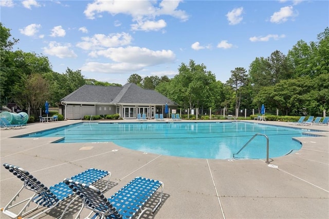 community pool featuring a patio area