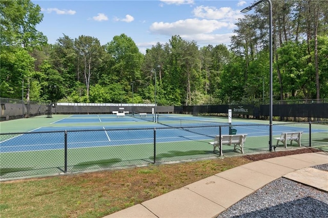 view of tennis court with fence