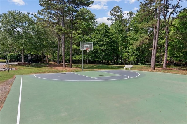 view of basketball court featuring a lawn and community basketball court