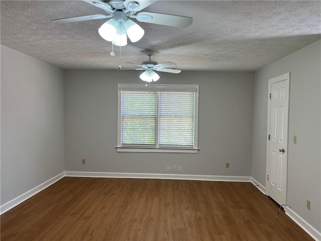 unfurnished room featuring dark wood-type flooring, ceiling fan, and a textured ceiling