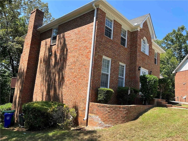 view of home's exterior featuring a yard