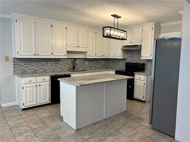 kitchen with sink, stainless steel fridge, a center island, pendant lighting, and white cabinetry