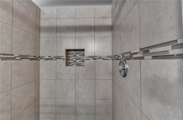 full bath featuring a tile shower