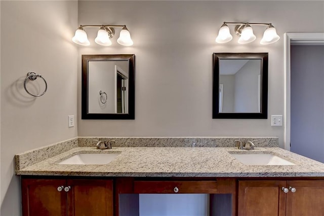 full bath with double vanity and a sink