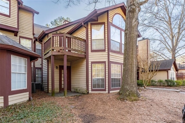 rear view of property with a balcony