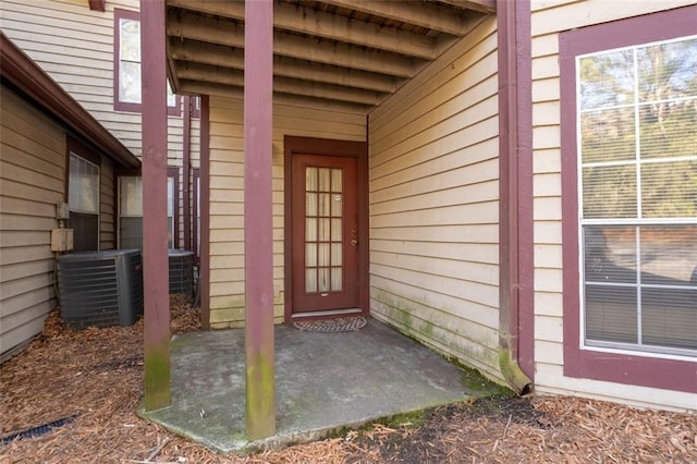 entrance to property featuring cooling unit