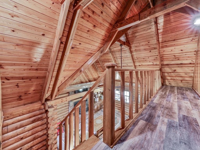 interior space featuring lofted ceiling with beams, wooden ceiling, and wood-type flooring