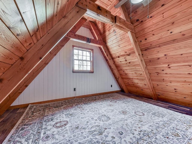 additional living space with wood ceiling, vaulted ceiling, and wood finished floors