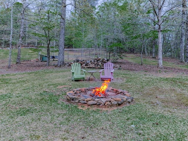 view of yard with an outdoor fire pit