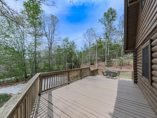 wooden deck with outdoor dining space