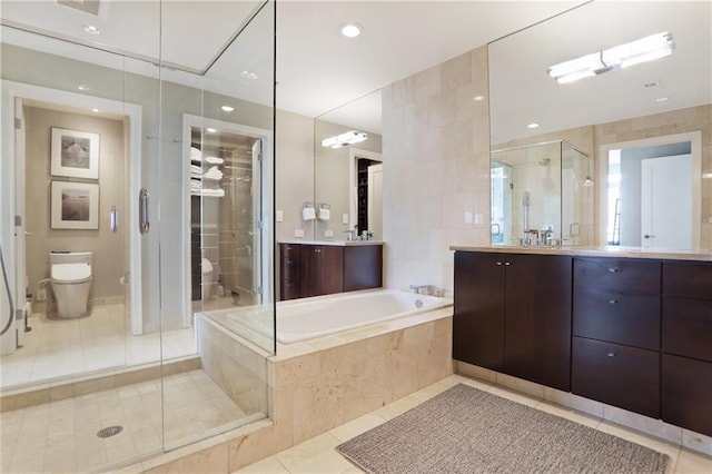 full bathroom featuring tile patterned flooring, vanity, independent shower and bath, and toilet