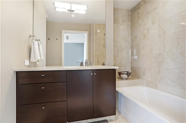 bathroom with vanity and a tub to relax in