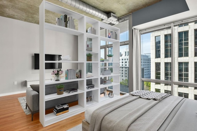 943 Peachtree St NE Unit 1109, Atlanta, GA 30309 - bedroom with hardwood / wood-style floors