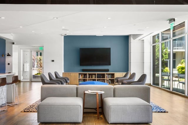 943 Peachtree St NE Unit 1109, Atlanta, GA 30309 - living room featuring hardwood / wood-style floors, a wall of windows, and plenty of natural light