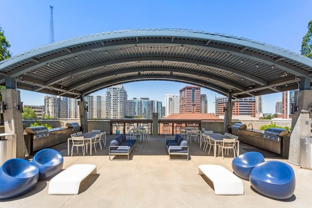 943 Peachtree St NE Unit 1109, Atlanta, GA 30309 - view of patio featuring a gazebo, area for grilling, and an outdoor kitchen