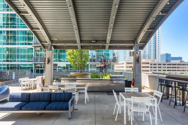 943 Peachtree St NE Unit 1109, Atlanta, GA 30309 - view of patio featuring an outdoor living space and area for grilling