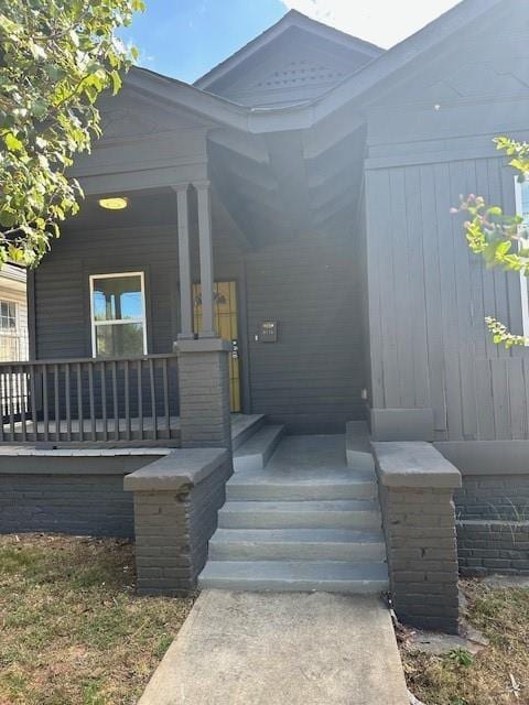 doorway to property with a porch