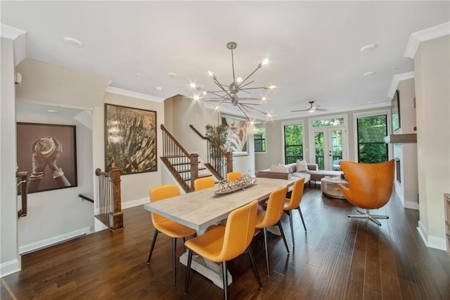 dining room with ceiling fan with notable chandelier, dark hardwood / wood-style flooring, and ornamental molding