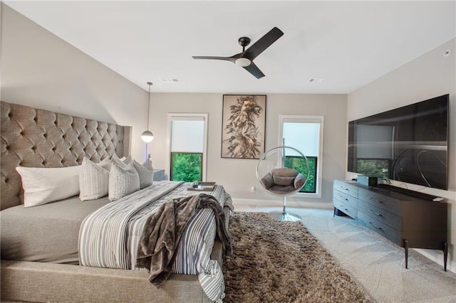 bedroom with ceiling fan and carpet flooring