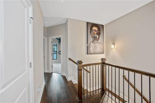 hallway with dark wood-type flooring