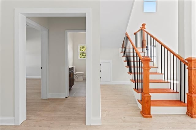 stairs with hardwood / wood-style floors