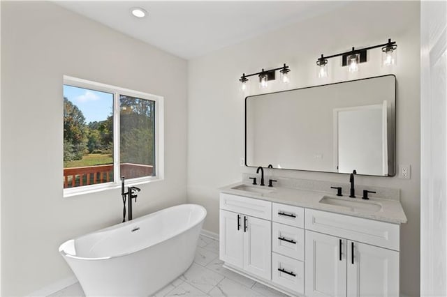 bathroom featuring vanity and a bathing tub