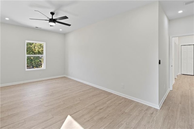 unfurnished room featuring ceiling fan and light hardwood / wood-style flooring