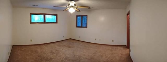 unfurnished room featuring carpet flooring and ceiling fan