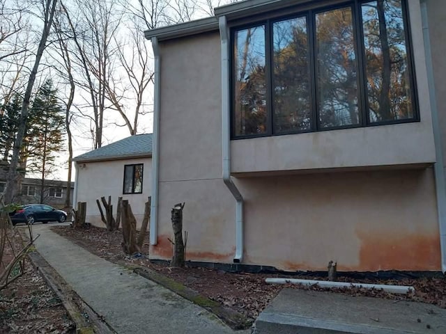 view of side of property with a garage