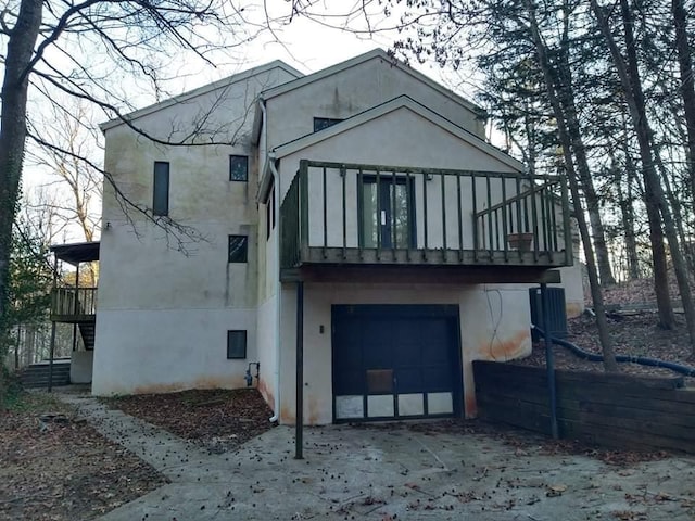 rear view of house with a garage