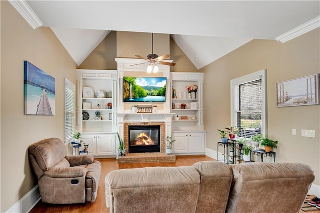 living room featuring built in features, a fireplace, lofted ceiling, light wood-style flooring, and baseboards