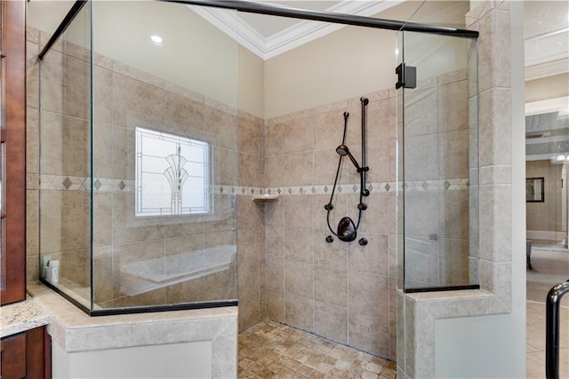 full bathroom featuring ornamental molding and tiled shower