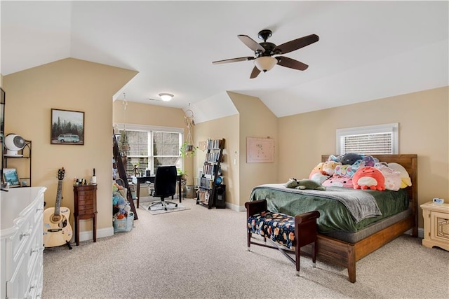 bedroom with lofted ceiling, ceiling fan, baseboards, and light colored carpet