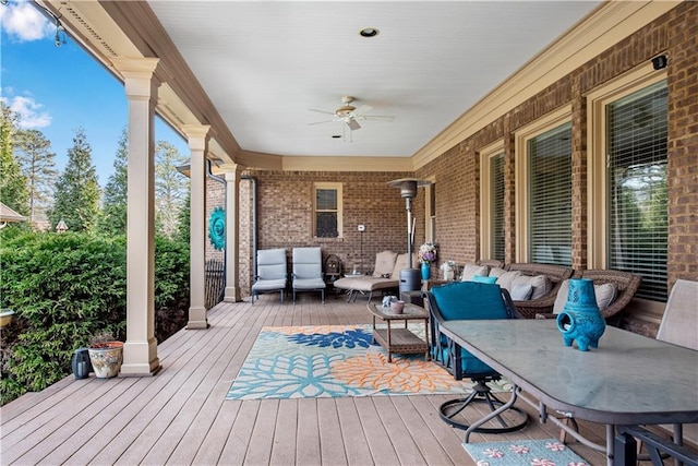 deck with ceiling fan and outdoor lounge area