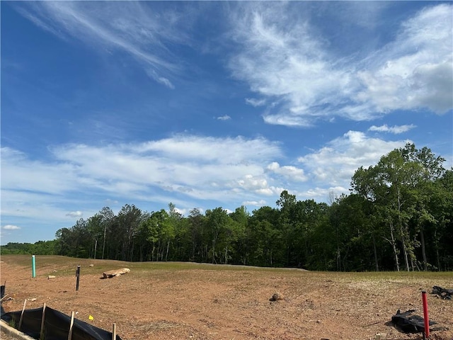 exterior space featuring a wooded view