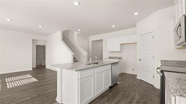kitchen with white cabinetry, dark wood-style flooring, a sink, and stainless steel appliances