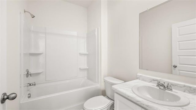 bathroom with toilet, vanity, and bathing tub / shower combination