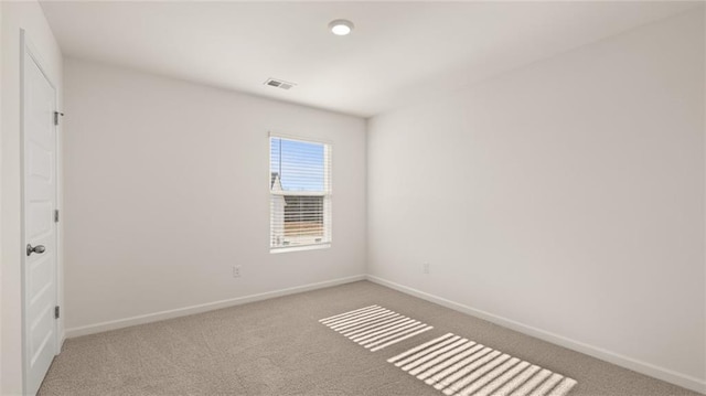unfurnished bedroom featuring carpet, baseboards, and visible vents